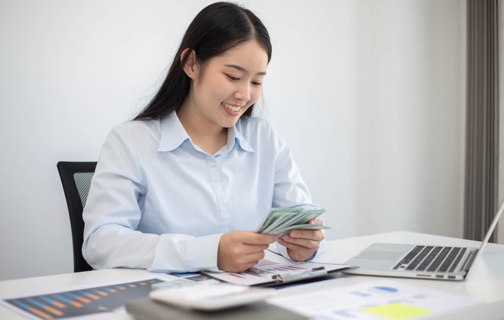 woman counting cash