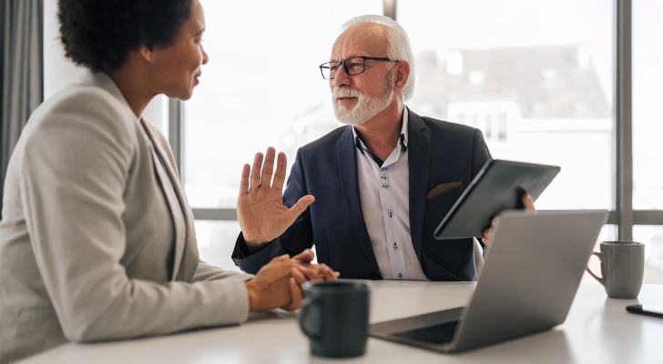 A financial advisor reviewing a retirement account with a client.