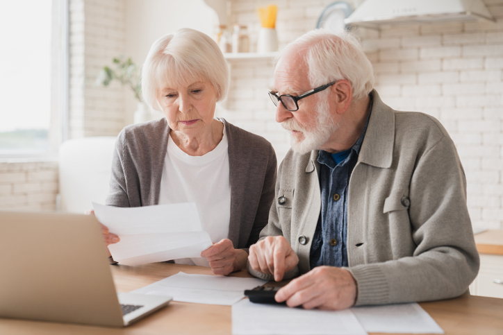 Older couple reviewing their retirement finances.
